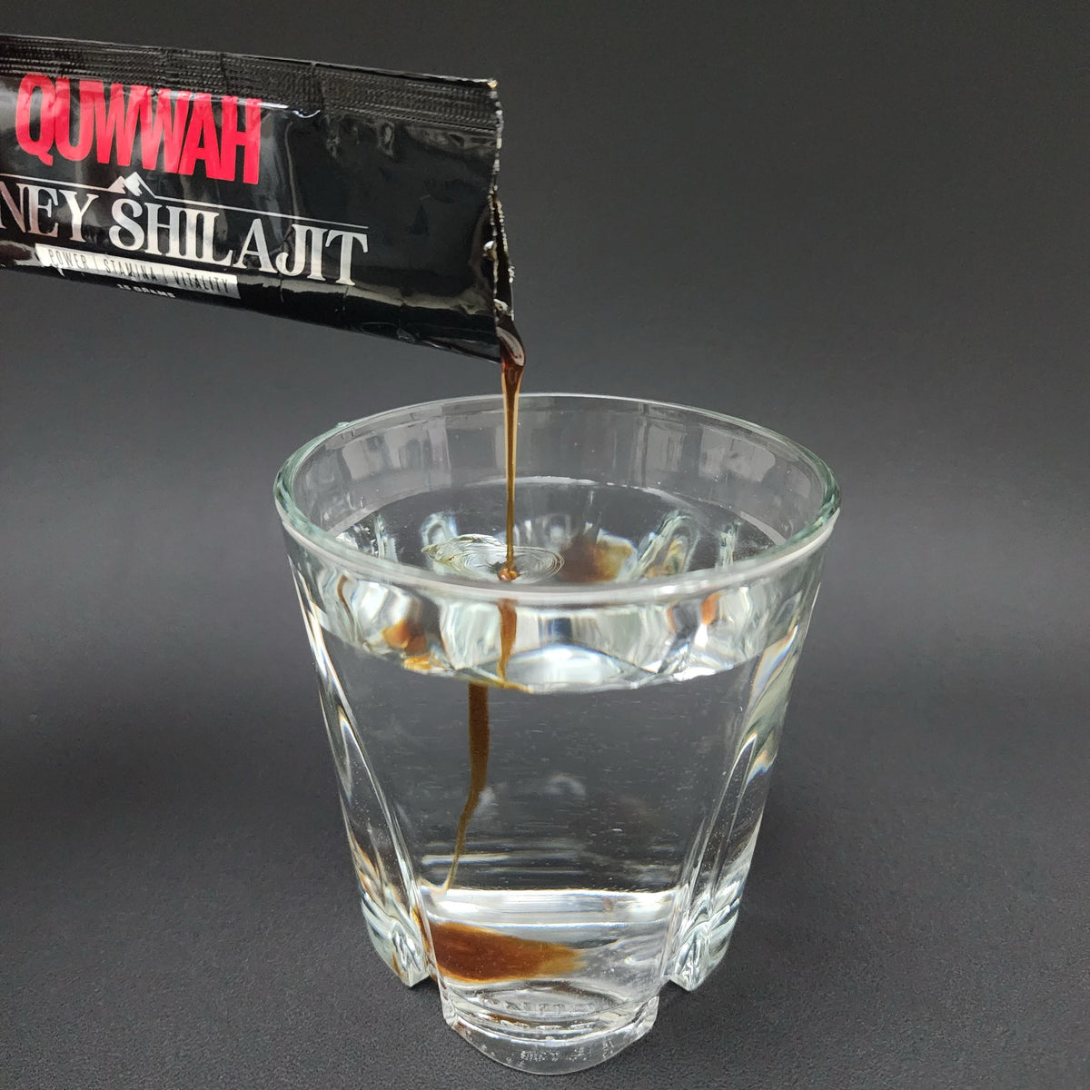 QUWWAH Honey Shilajit Salajeet sachet mixed with warm water for daily use